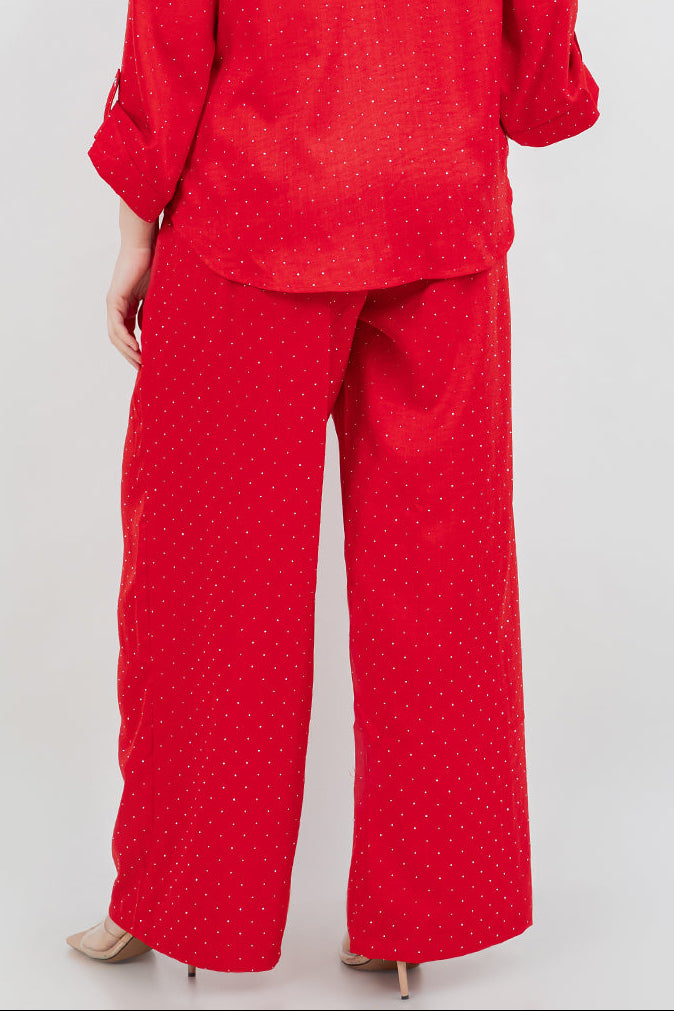 Woman wearing a red outfit with a white background