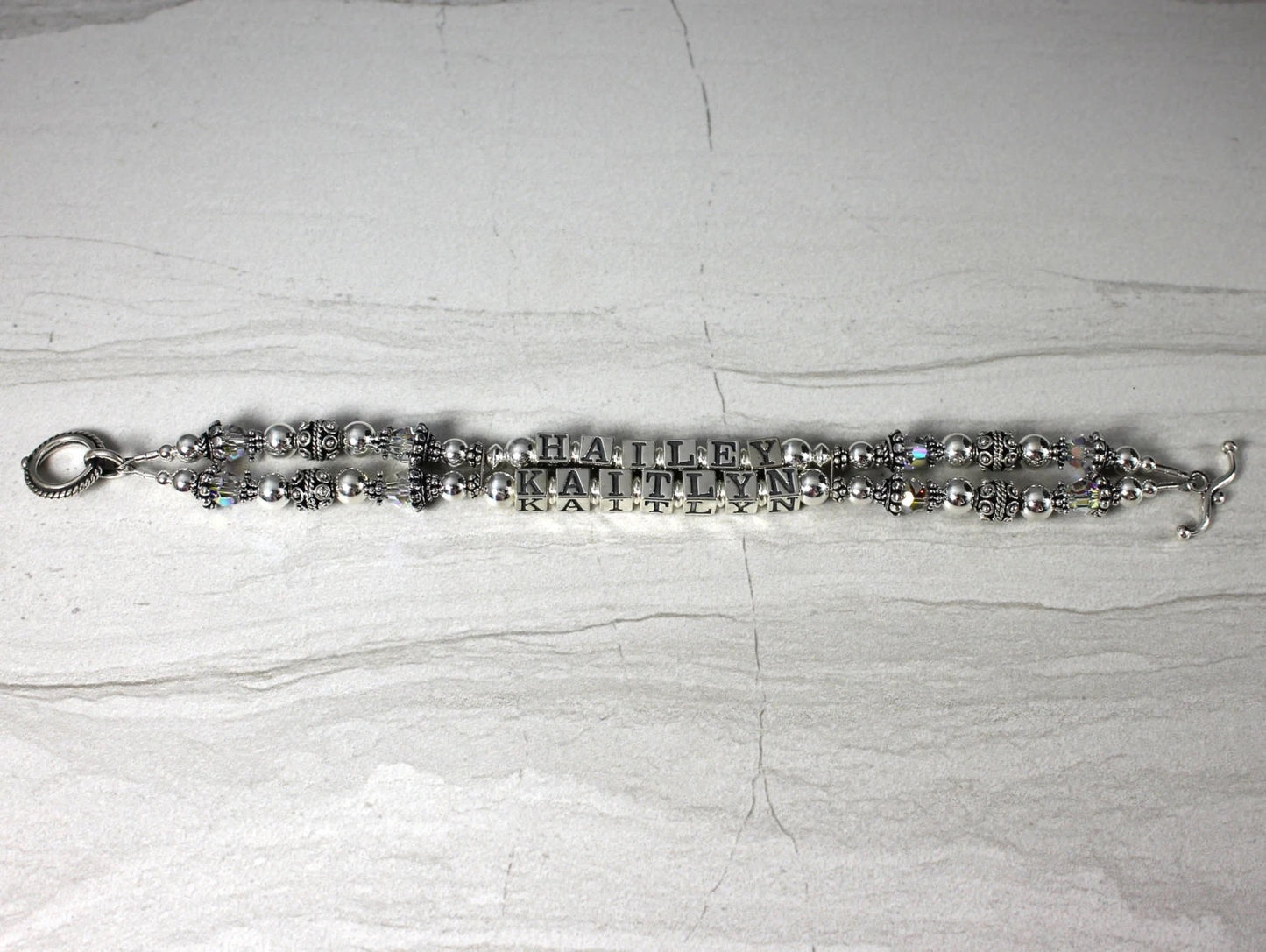 Two Strand sterlign silver mothers bracelet, Names of children in the center. toggle clasp closure