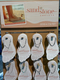 Display of Sandstone Anklets with packaging and promotional text.