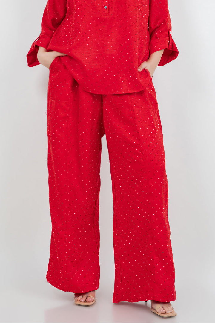 Woman wearing a red outfit on a white background