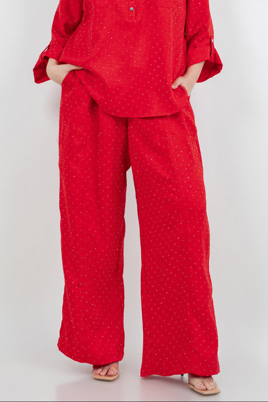 Woman wearing a red outfit on a white background