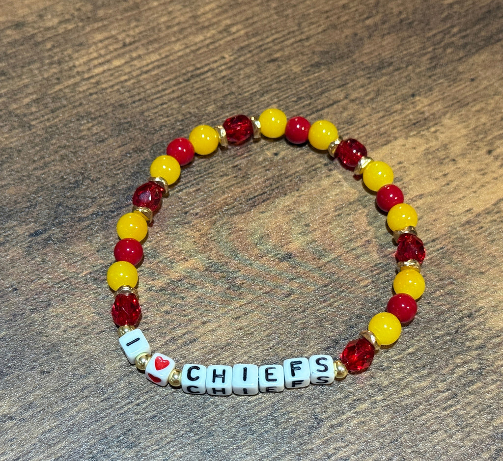 Beaded bracelet with 'I ❤️ CHIEFS' on a wooden surface