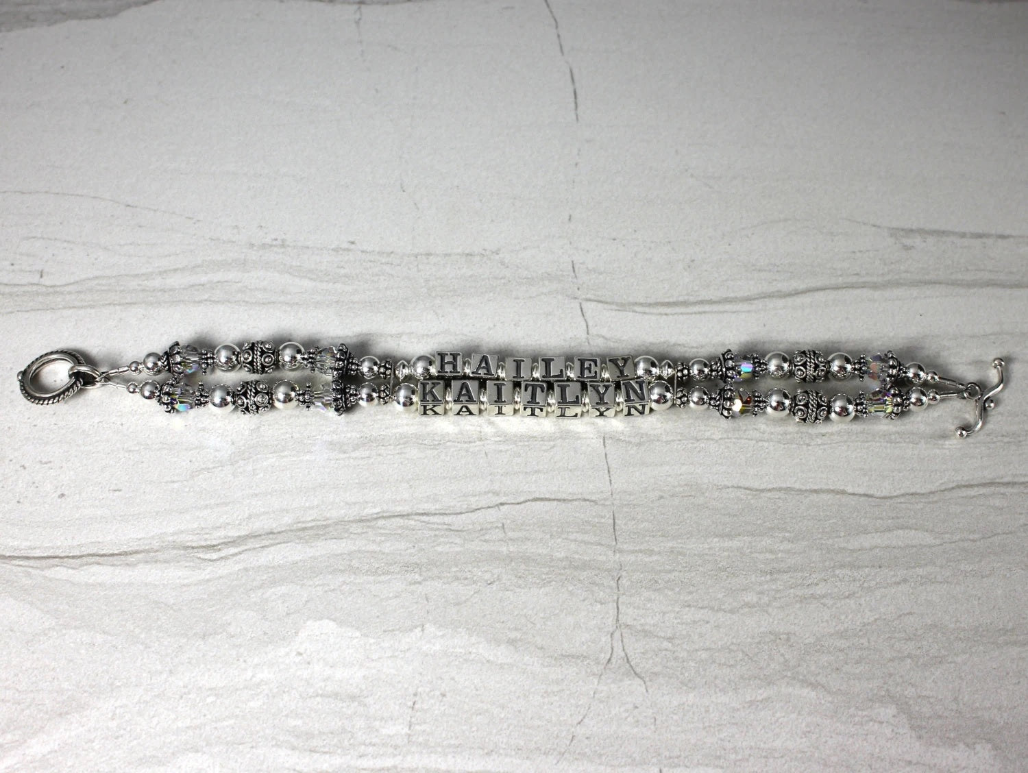 Two Strand sterlign silver mothers bracelet, Names of children in the center. toggle clasp closure
